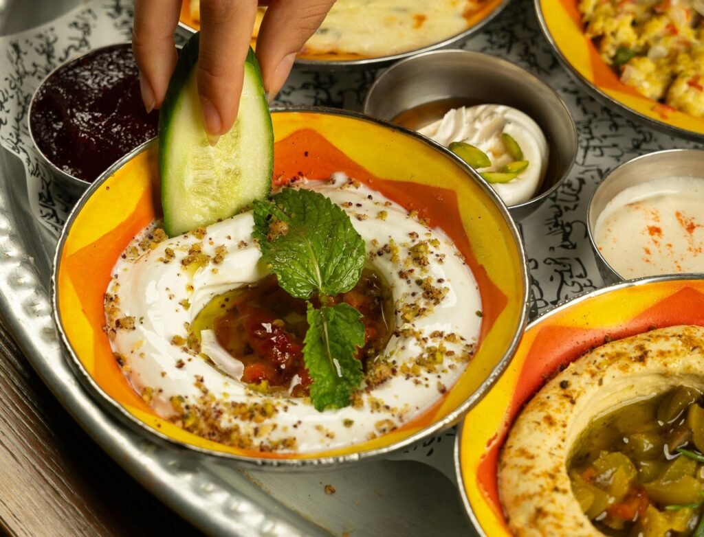 Cucumber hummus bites topped with paprika