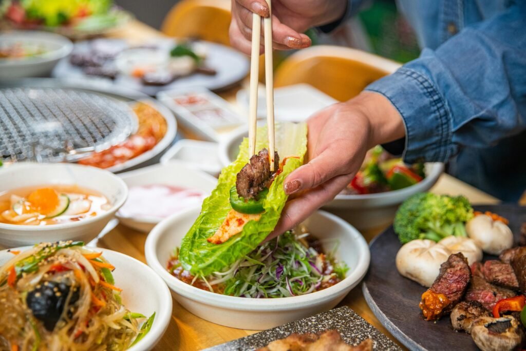 Spicy chicken lettuce wraps served on a white plate