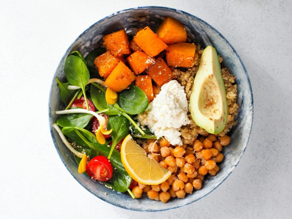 Chickpea and sweet potato bowl with herbs and tahini drizzle