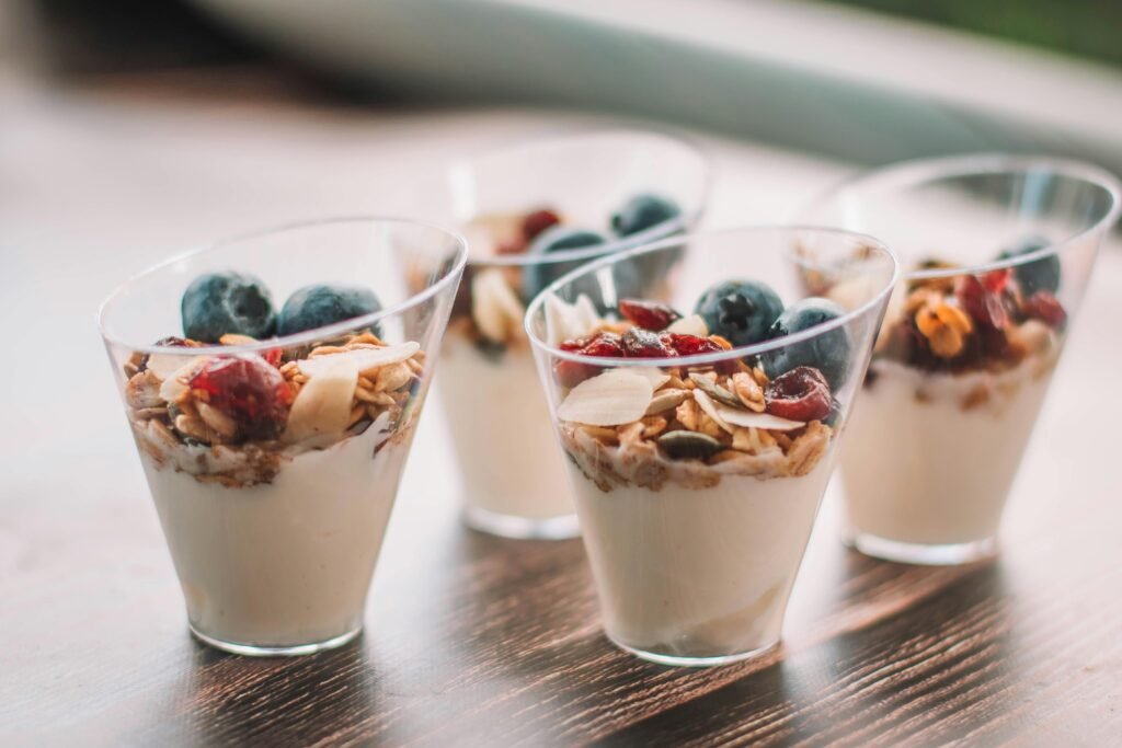 Layered yogurt and berry parfait in a jar