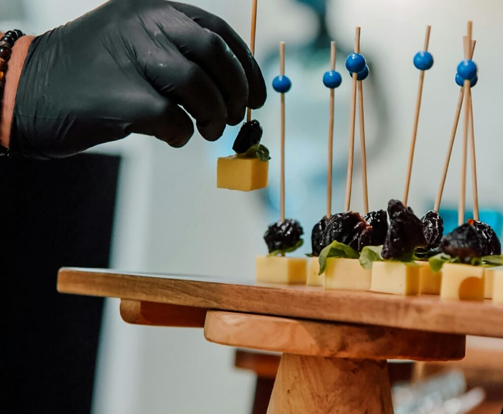 Cheese and fruit skewers arranged on a platter